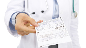 Closeup on doctor woman giving prescription